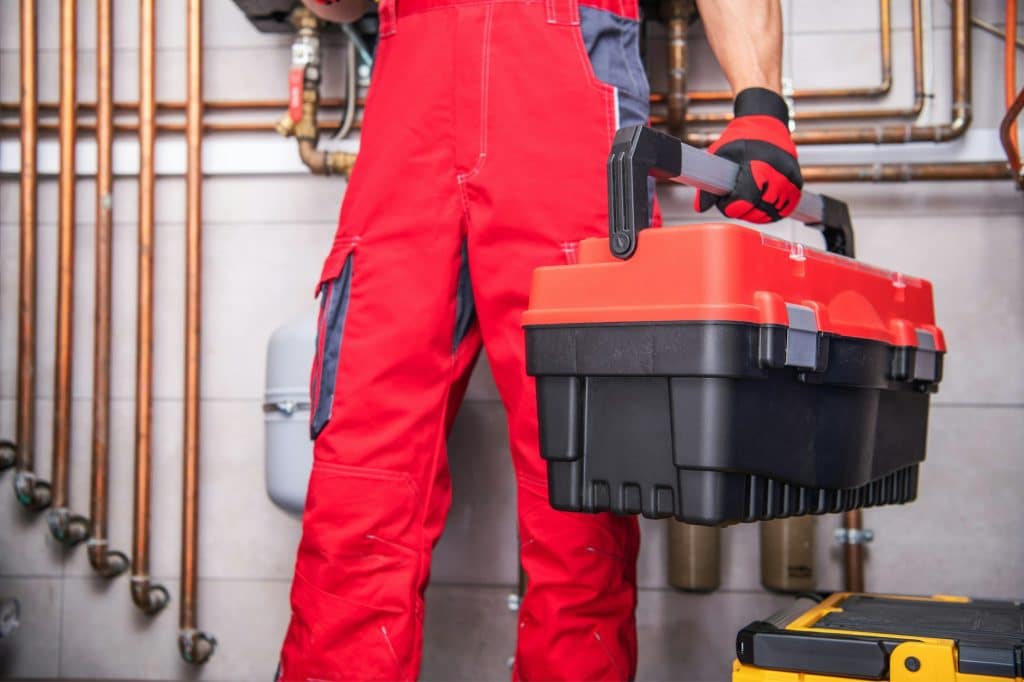 Professional Ductless Heat Pumps in King & Pierce Counties | HVAC Warranty Home Call Service Worker with His Tools Box